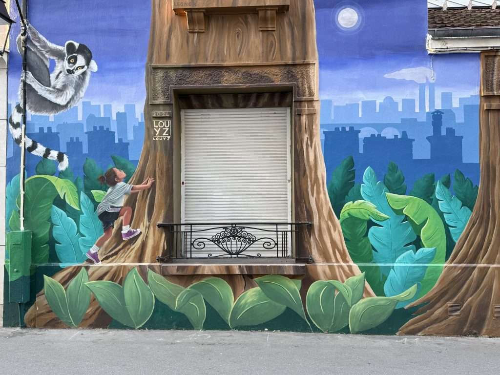 Girl Climbing A Tree With A Lemur Street Art In Paris